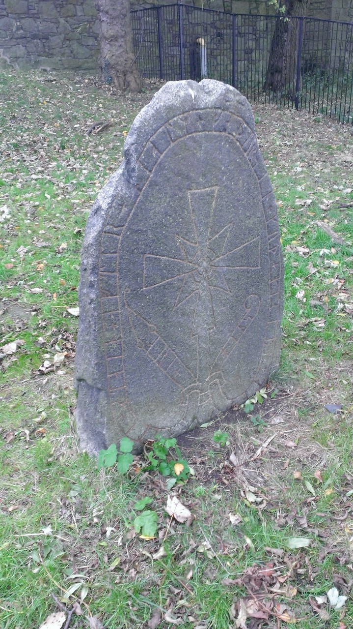 Runestone in situ under the castle esplanade - Photo by Society of Antiquaries of Scotland